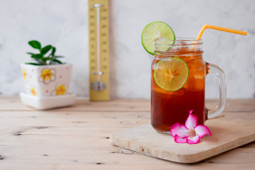 ice tea on wooden table in summer.