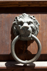 Volterra (SI), Italy - April 25, 2017: An metal old door knocker in Volterra town, Tuscany, Italy