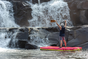Fototapeta na wymiar Adventurer on the rapids of the mountain river