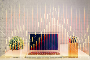 Double exposure of chart and financial info and work space with computer background. Concept of international online trading.