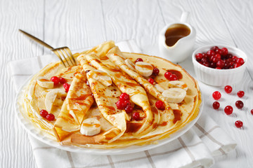 sweet crepes with berries on a plate