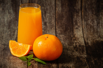 Fresh orange juice in a glass and fresh orange