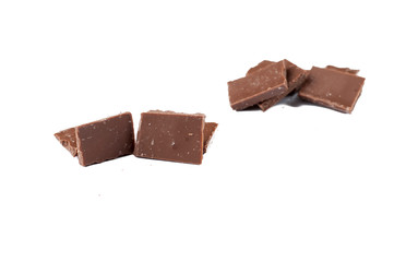 Chocolate cubes isolated on white background.Copy space