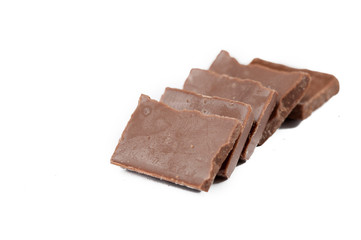 Chocolate cubes isolated on white background.Copy space