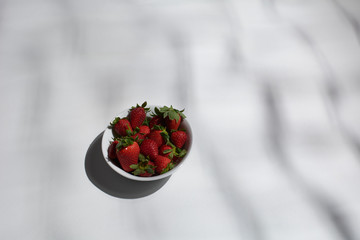Bowl full of ripe strawberries ready to eat