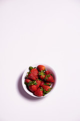 Bowl full of ripe strawberries ready to eat