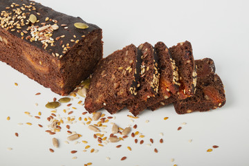 fresh bread with various seeds (pumpkin, dried apricots, flax, sunflower, sesame, prunes) is...