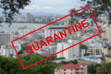 Text warning about quarantine against the background of a Bay view in Pattaya, Thailand.