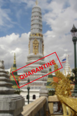 Fototapeta na wymiar Text warning about quarantine against the background of Buddhist architecture in Pattaya, Thailand.