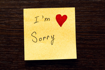 The square sticker reads "I'm sorry" and "heart".