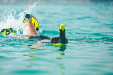 woman in snorkeling mask in sea water