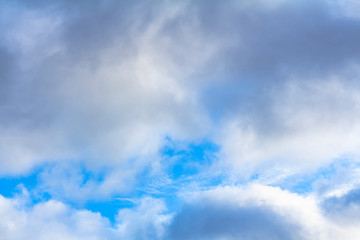 The blue sky peeks through the clouds