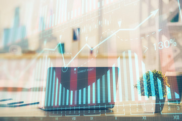 Stock market graph and table with computer background. Multi exposure. Concept of financial analysis.