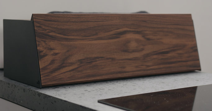 walnut wood breadbox on kitchen countertop