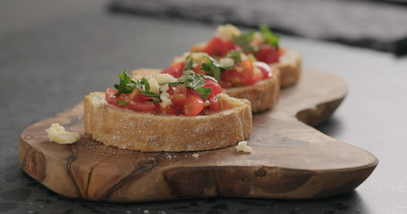 bruschetta with cherry tomatoes and spinach leaves