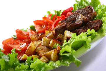 Meat plate with potatoes and souce