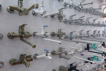 Range of faucets at the hardware store. Promyshlennest