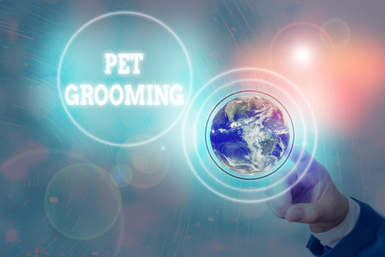 Writing note showing Pet Grooming. Business concept for hygienic care and enhancing the appearance of the pets Elements of this image furnished by NASA