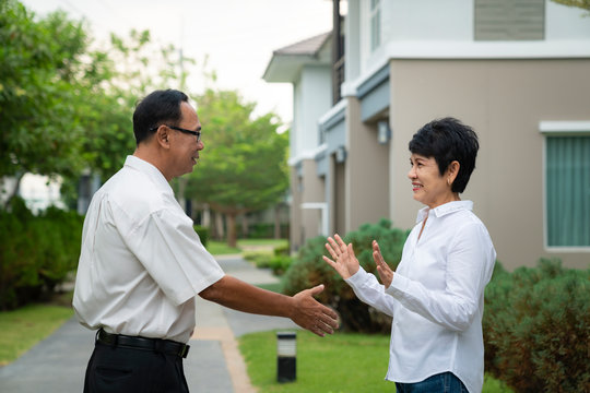 Old asian people no greeting by shakehands togather  and use a mask for prevent covid 19