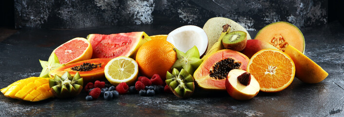 Tropical fruits background, many colorful ripe fresh tropical exotic fruits