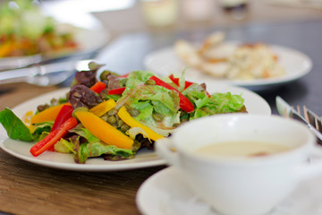 A fresh vegetable salad. Green salad on a white plate. Food.