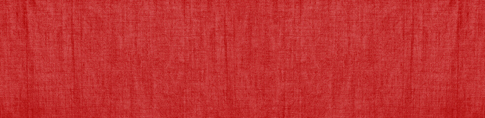 Abstract red background. Texture of natural cotton fabric. Red banner with copy space for your...