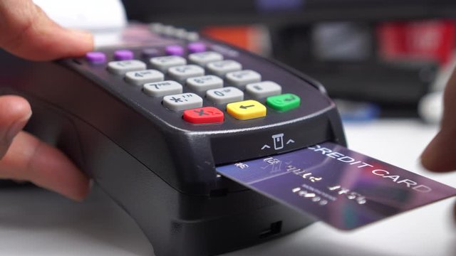 Cashier hold electronic transaction machine, insert Mock up Credit card payment for purchase or sell products and service, business swiping buy shopping counter near accounting software cash