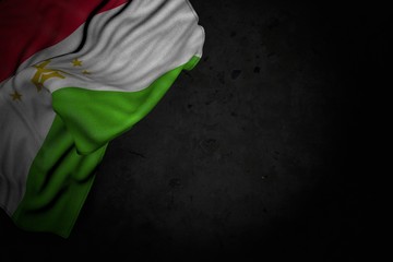 beautiful any feast flag 3d illustration. - dark picture of Tajikistan flag with large folds on black stone with empty place for content