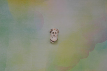 sculpture of a greek man's face on a neutral background. Space for text. Editorial illustrative foto