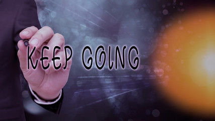 Conceptual hand writing showing Keep Going. Concept meaning make an effort to live normally when in...