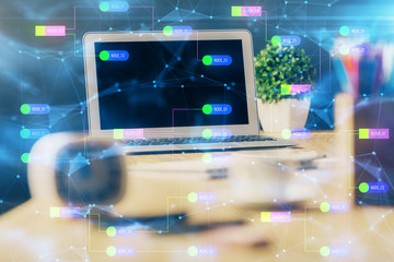 Double exposure of desktop computer and technology theme hologram. Concept of software development.