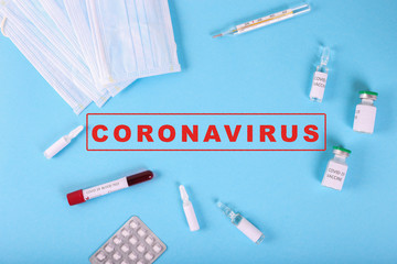Top view of positive COVID-19 test and medical mask, vaccine and pills. Medicine infectious concept. Pandemia