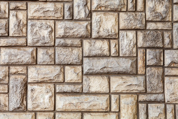 old grey stone wall made of stone blocks
