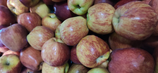 Fresh apple fruits in supermarket sales display