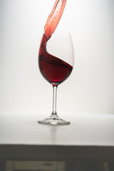 red wine splash in glass