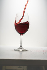red wine splash in glass