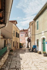 Travel summer concept. Old city view of Europe, Croatia, Istria region, Rovinj. Empty street with old buildings with shutters.