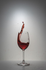 red wine splash in glass