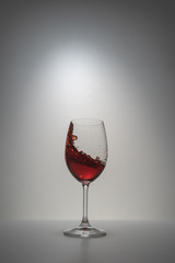 red wine splash in glass