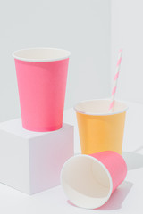 Vertical composition of bright paper disposable, compostable, recyclable cups