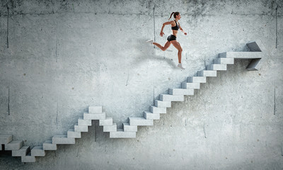 Obraz na płótnie Canvas Image of sport woman walking upstairs