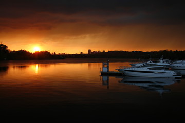 sunset on lake with beautiful yacht