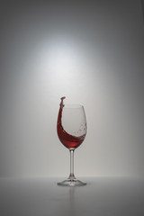 red wine splash in glass