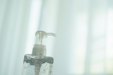 Transparent hand sanitizer gel dispenser  for hand hygiene. Clear sanitizer in pump bottle, for killing germs, bacteria and virus.