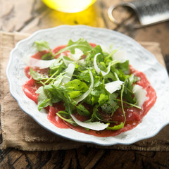 Beef carpaccio with arugula and Parmesan cheese