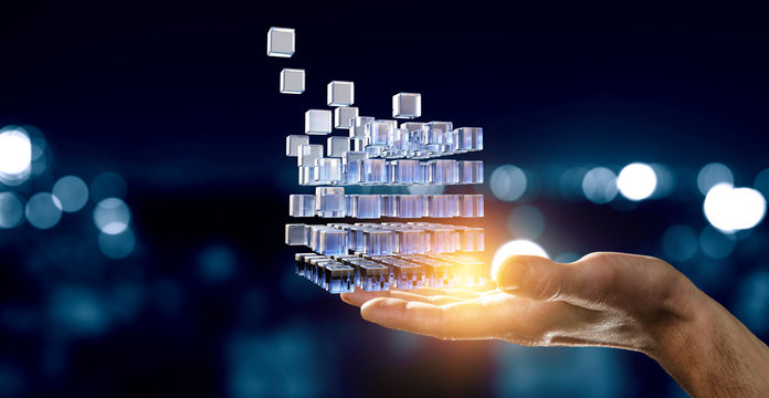 Hand holding glowing cubes. Innovation and creativity concept.