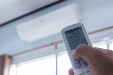 Closeup view about using some appliance such as air condition.