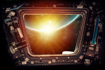 Earth view with sunrise from a Spacecraft. Elements of this image furnished by NASA