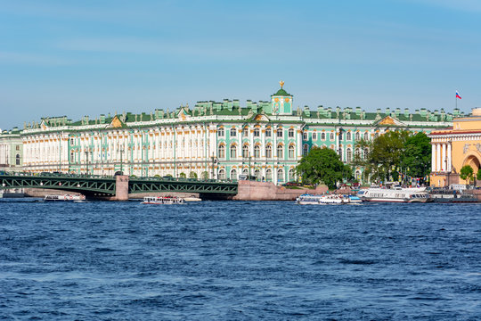 State Hermitage museum (WInter palace) and Palace bridge over Neva river, Saint Petersburg, Russia