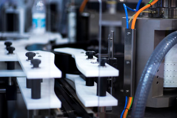 pharmaceutical packing production line conveyer at manufacture pharmacy factory. Authentic shot in challenging conditions. maybe little blurred